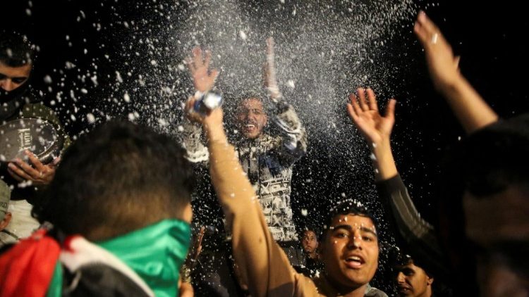 Palestinians react to news on a ceasefire deal with Israel, in Khan Younis in the southern Gaza Strip