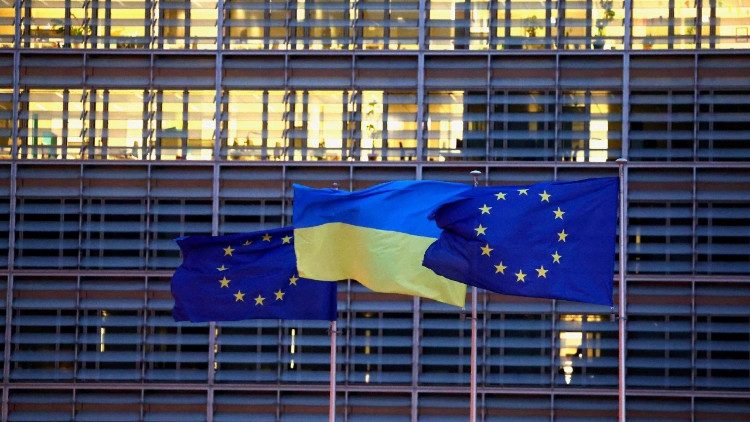 European Union flags and a Ukrainian flag flutter outside the EU Commission headquarters in Brussels