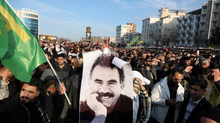 Demonstrators hold a photo of jailed Kurdish militant leader Ocalan