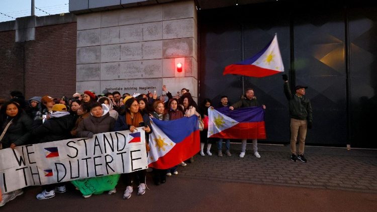 Supporters of former Philippine President Rodrigo Duterte wait for his arrival at the Scheveningen Prison following his arrest at the request of the International Criminal Court in The Hague, Netherlands, 