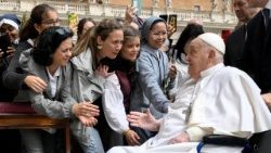 Pope Francis meets with people as he unexpectedly appears during the Palm Sunday Mass in Saint Peter's Square at the Vatican