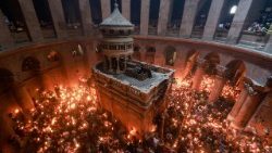 People gather at the Church of the Holy Sepulchre in Jerusalem's Old City