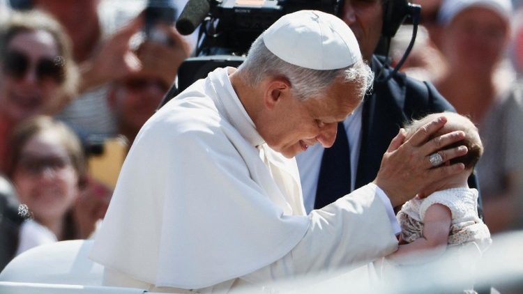 File photo of Pope Leo XIV blessing a child at his weekly General Audience 