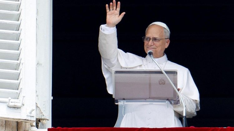 Pope Leo XIV leads the Angelus prayer from his window at the Vatican
