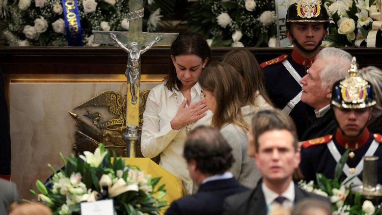 Maria Claudia Tarazona, wife of Colombian Senator Miguel Uribe Turbay, stands next to his coffin in Colombia's Congress, in Bogota, on August 11, 2025
