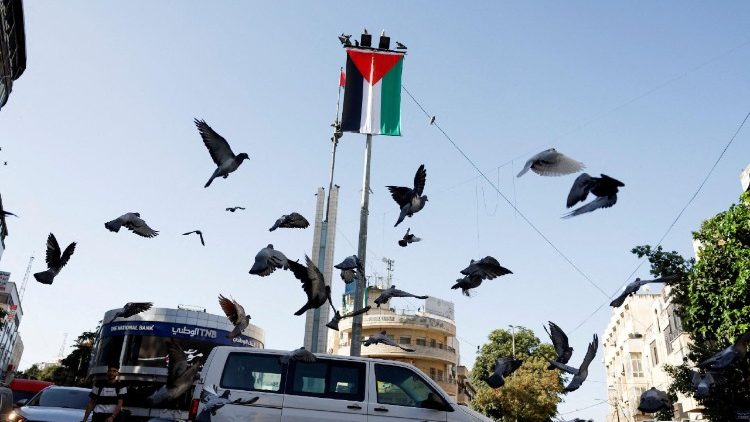 A Palestinian flag hangs on a pole in the center of Ramallah in the Israeli-occupied West Bank