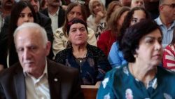 Iraqi Christians attend the reopening ceremony of the Tahira Chaldean Church after its reconstruction, in Mosul