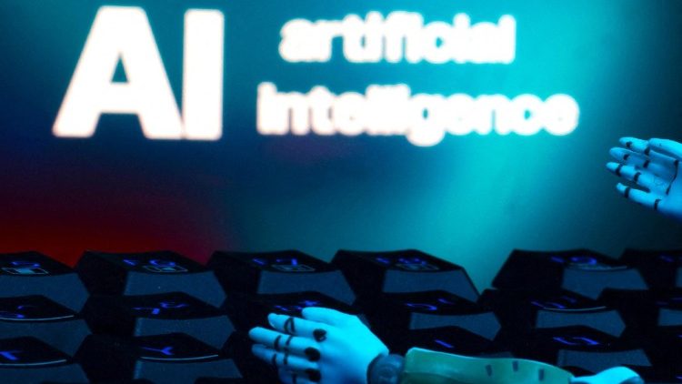 FILE PHOTO: Illustration shows message reading "AI artificial intelligence", keyboard and robot hands