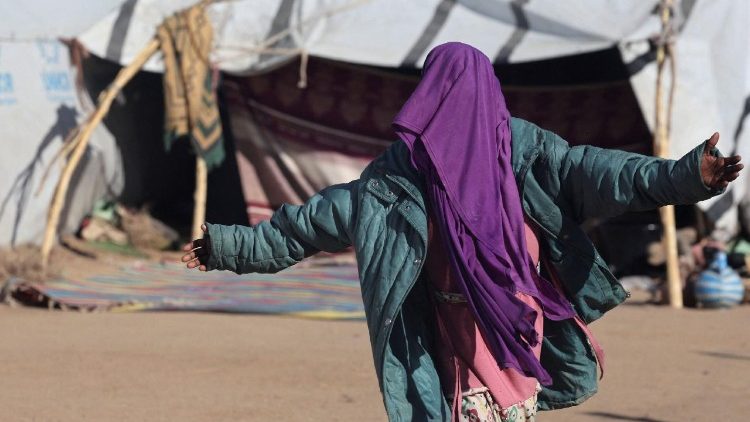 A Sudanese refugee from al-Fashir, gestures inside the Tine transit refugee camp in eastern Chad