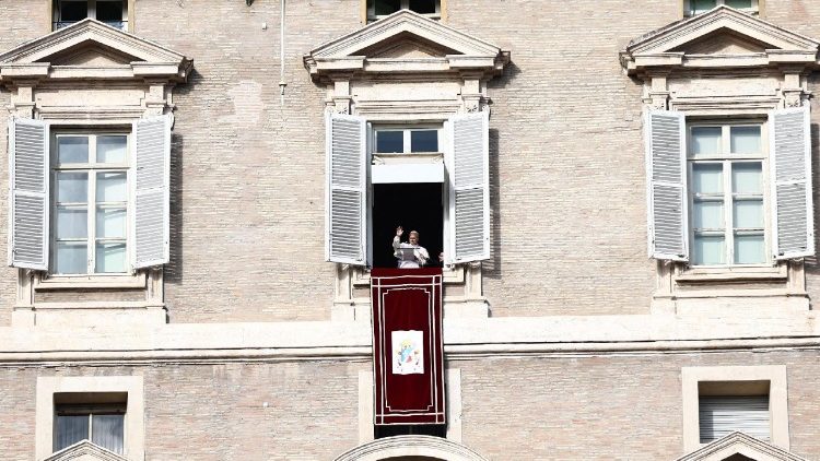 Pope Leo leads the Angelus prayer from the window of the Apostolic Palace at the Vatican