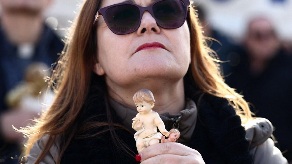 Pope Leo leads the Angelus prayer from the window of the Apostolic Palace at the Vatican