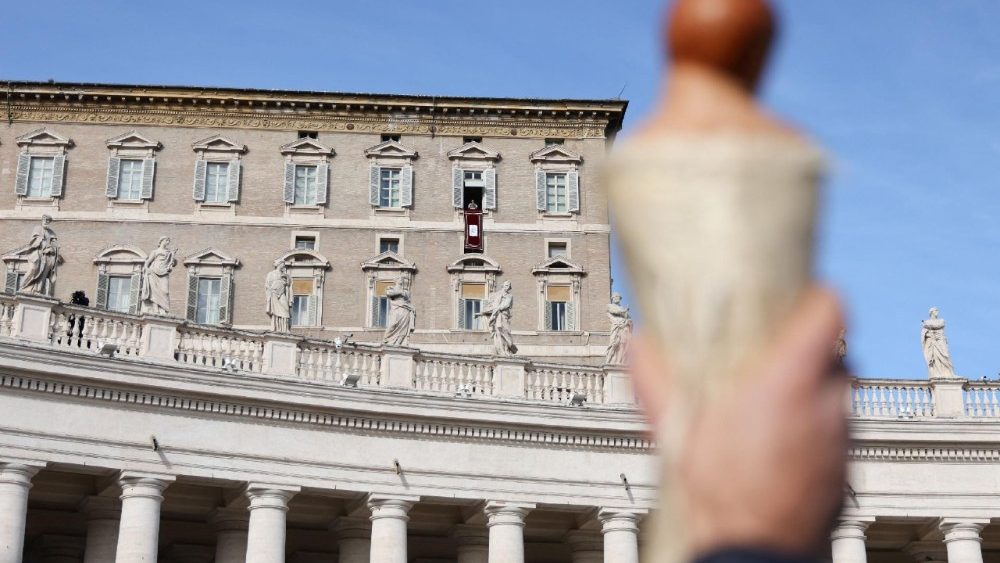 Pope Leo leads the Angelus prayer from the window of the Apostolic Palace at the Vatican