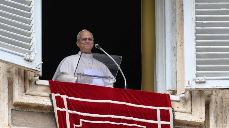 Pope Leo leads the Angelus prayer from the window of the Apostolic Palace at the Vatican