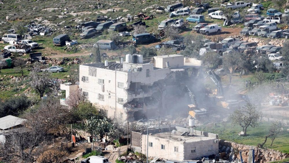 FILE PHOTO: Heavy machinery demolishes a Palestinian building near Hebron in the Israeli-occupied West Bank