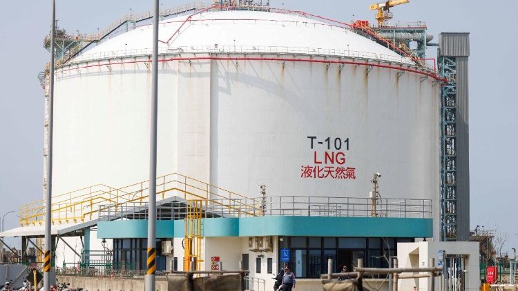 A security guard stands at the entrance of Guan-Tang LNG Receiving Terminal, a liquefied natural gas import facility located in Taoyuan
