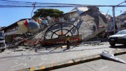 A building lies in rubble in General Santos after the earthquake
