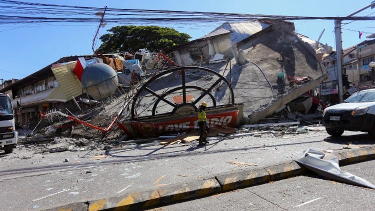 A building lies in rubble in General Santos after the earthquake