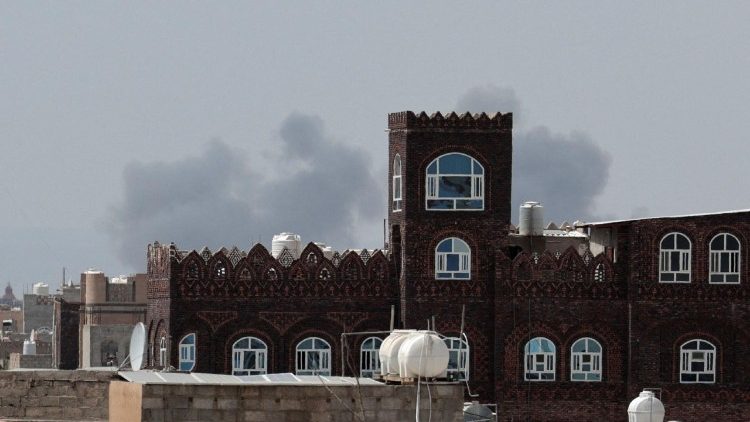 Smoke rises after an airstrike hit the Sanaa International Airport
