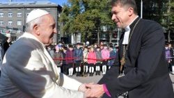 File photo of Pope Francis shaking hands with Lutheran Archbishop Urmas Viilma in Tallinn, Estonia