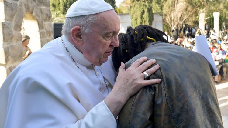 Pope Francis hugs a migrant during his Apostolic Journey to Malta