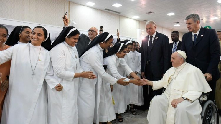 Pope Francis greets several Apostolic Carmel Sisters at Sacred Heart School