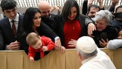 Pope Francis blesses Ilaria Sambucci, a pregnant intern with Vatican News