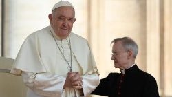 Pope Francis holds his hands in prayer at a weekly General Audience