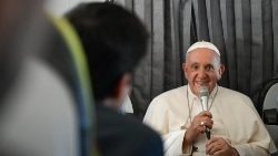 Pope Francis holds a press conference aboard the return flight from Portugal
