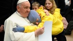 Pope Francis embraces a young person with an illness