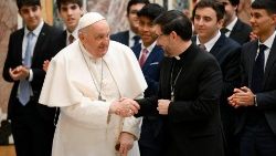 Pope Francis shakes hands with Cardinal Jose Cobo