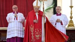 Pope Francis prays at Palm Sunday Mass in St. Peter's Square