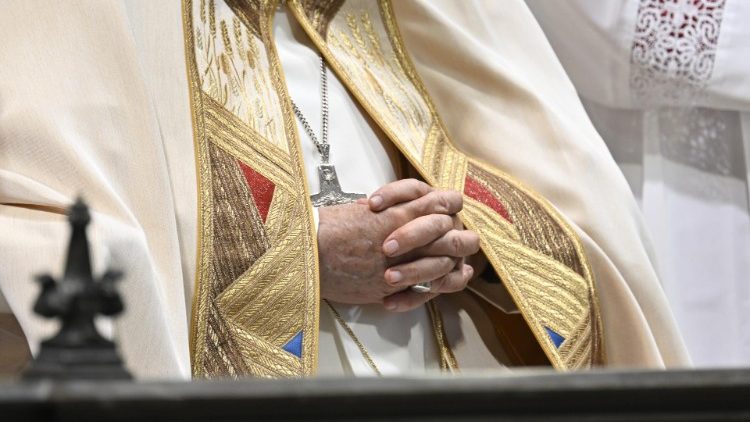 File photo of Pope Francis in prayer