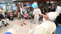 Pope Francis visiting with workers at the Luna Park at Ostia Lido (Rome)