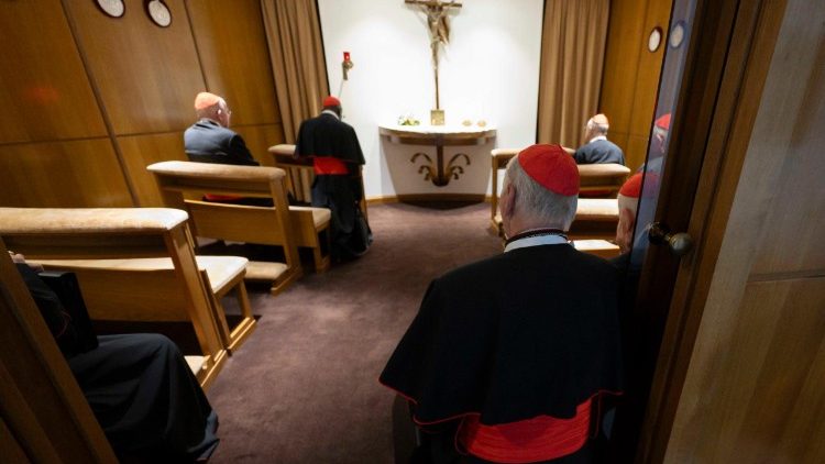 Cardinals pray before the Blessed Sacrament in a chapel near the New Synod Hall