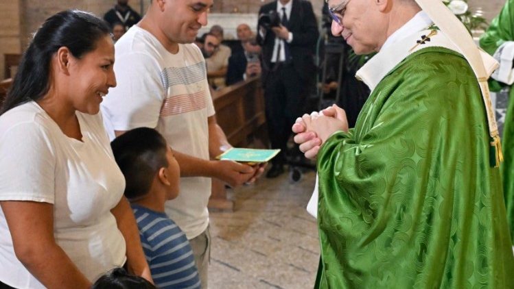 A Peruvian family brings the Eucharistic gifts to Pope Leo during Mass