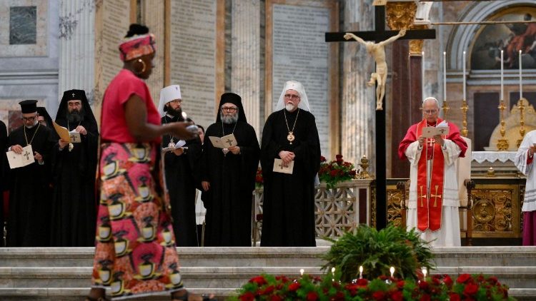 A candle is being brought to the foot of the cross, reflecting on the Beatitudes 