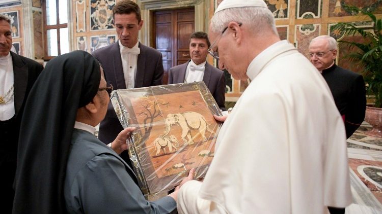 Pope Leo XIV receives gifts from participants in the audience