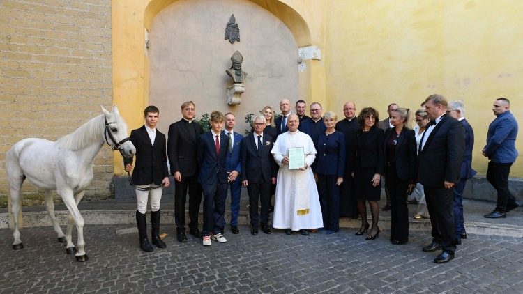 Pope Leo poses for a group photo