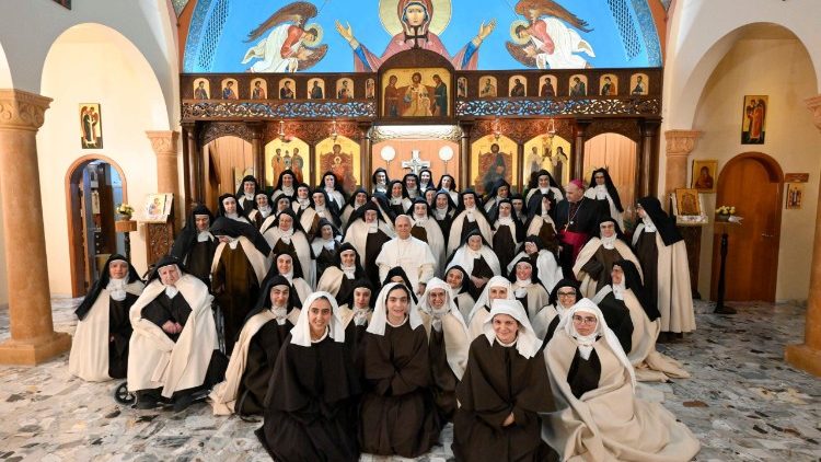 Pope Leo poses for a group photo with the nuns