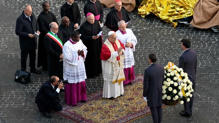 Pope Leo offers a bouquet of flowers at the base of the 12 meter tall column of the Virgin Mary
