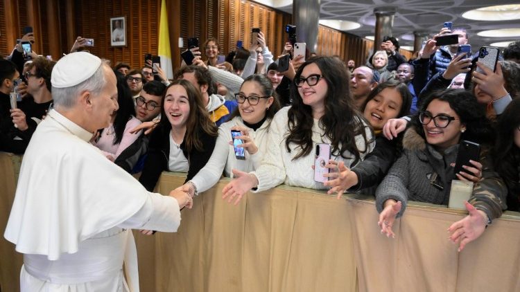 Pope Leo greets some of the young people in St Paul VI Hall