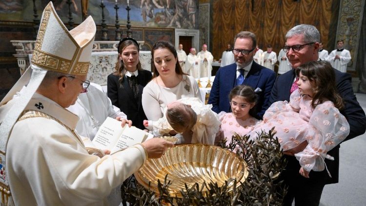 The Pope baptizes one of the children in the Sistine Chapel