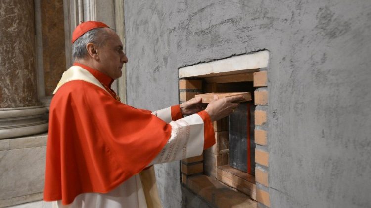 Cardinal Archpriest Gambetti places a brick in the wall that seals the Jubilee Holy Door of St. Peter's Basilica