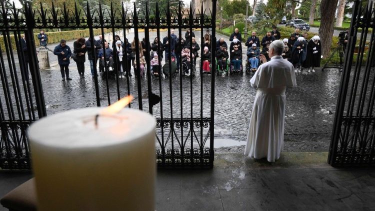 Pope Leo blesses sick people at the Lourdes Grotto in the Vatican Gardens