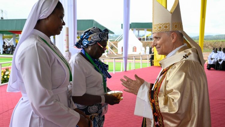 Pope Leo receives gifts during the Offertory Procession at the Mass