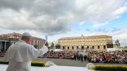 Pope Leo XIV greets the crowds gathered in Piazza del Plebiscito