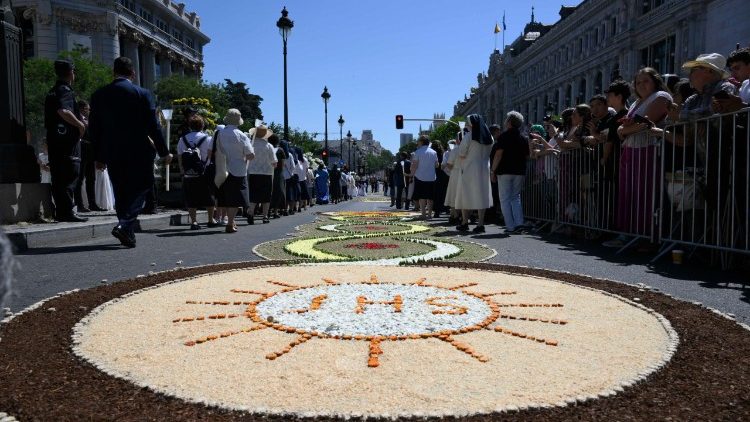 Traditional flower arrangements decorating the streets leading up to the piazza