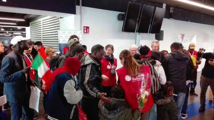 Refugees receive a welcome at Fiumicino Airport