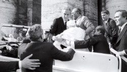 Angelo Gugel (standing, left, in the popemobile) holds Pope John Paul I's arm after he was shot on May 13, 1981