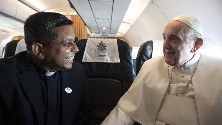 Cardinal-elect George Jakob Koovakad with Pope Francis aboard the papal plane